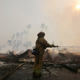A firefighter mops up after the 2017 Thomas Fire, California’s largest wildfire on record.